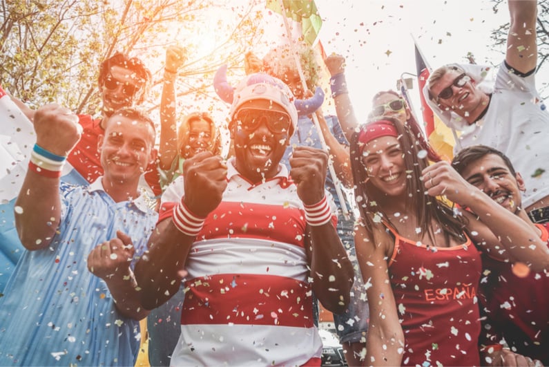 Multinational football supporters celebrating the begin of world competitio