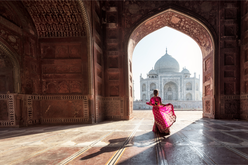 Woman in red saree/sari in the Taj Mahal, Agra, Uttar Pradesh, India