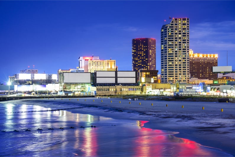 Atlantic City, New Jersey, USA resort casinos cityscape on the shore at night