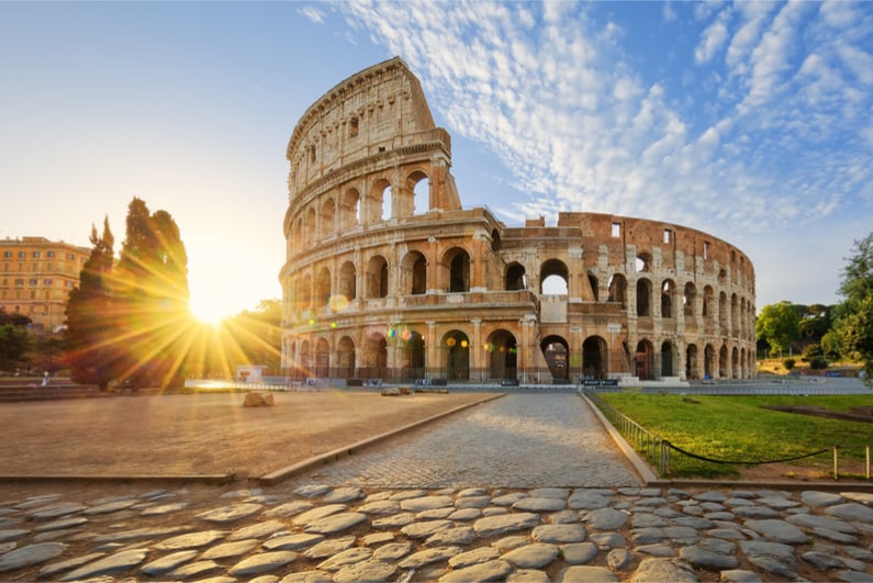 View of Colosseum in Rome and morning sun, Italy