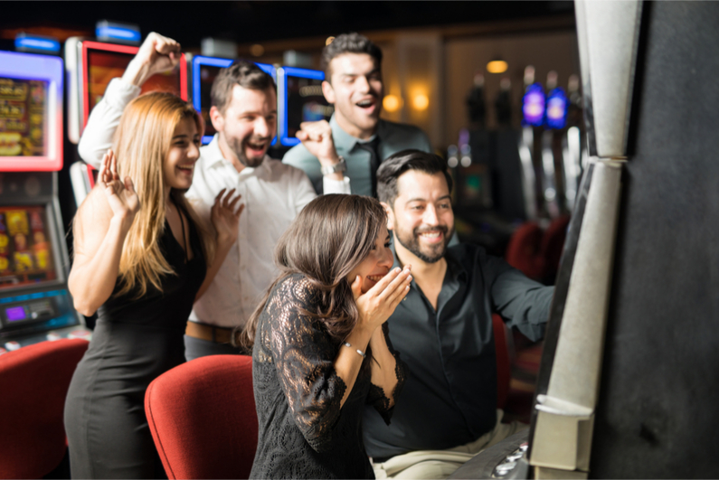 A winner shows her joy at winning on the slots.