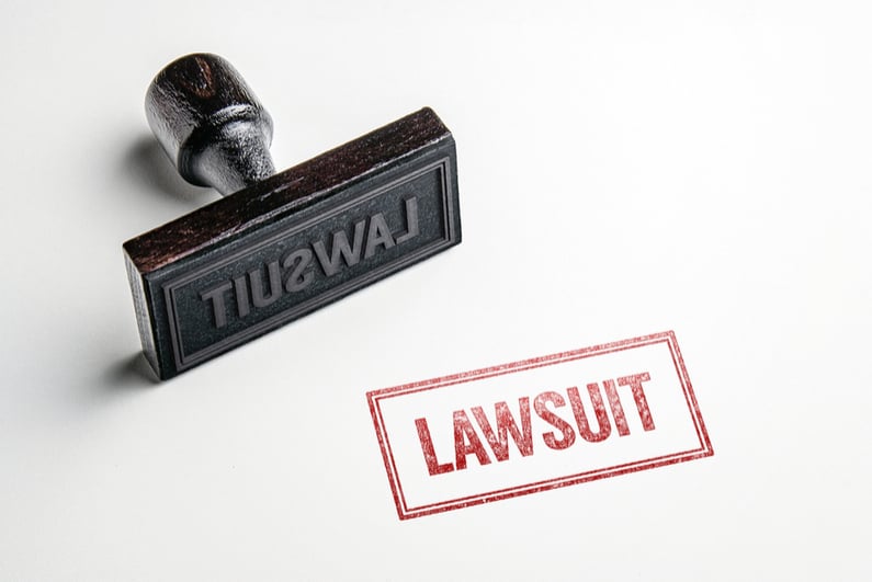 Rubber stamp that says LAWSUIT