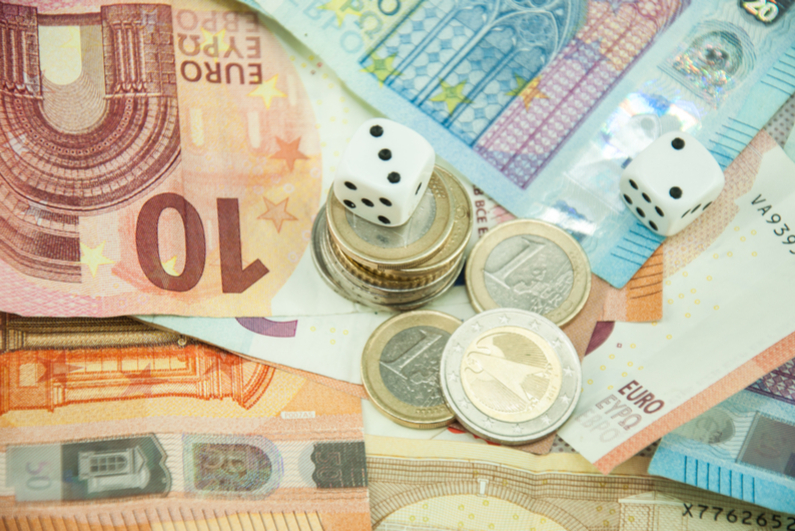 Euro currency and coins with dice