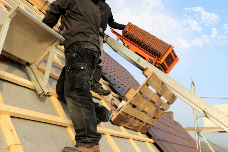 Man repairing a roof