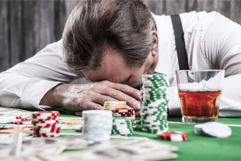 Man depressed at losing in a casino