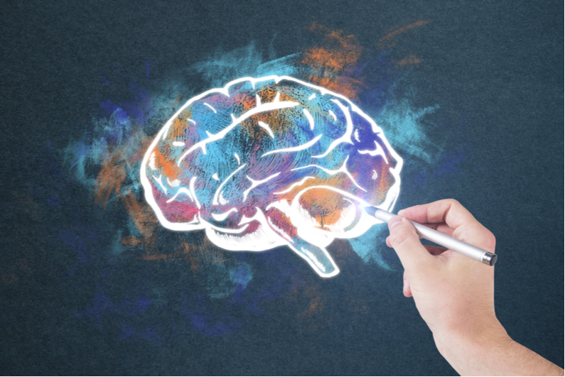 Hand doing colorful drawing of brain