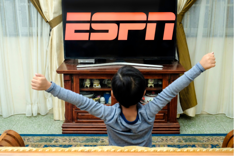 Boy excited by watching ESPN