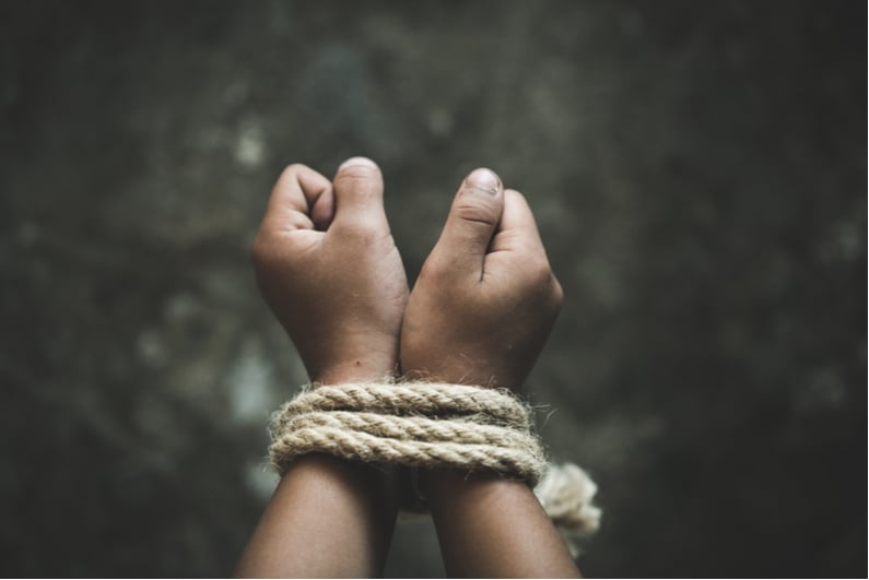 Hands tied with rope