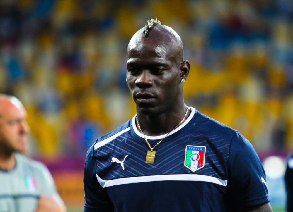 mario balotelli wearing italian soccer team gear