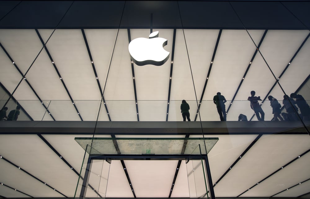 Apple logo on a glass-fronted building