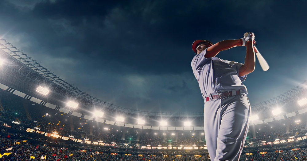 baseball player holding bat on pitch