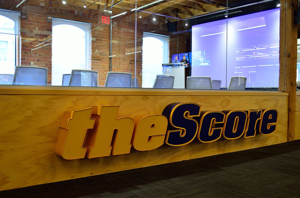 reception desk area with chairs and glass partitioning at theScore company premises