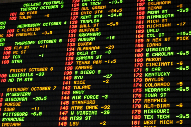Football odds betting board at a Las Vegas casino sportsbook.