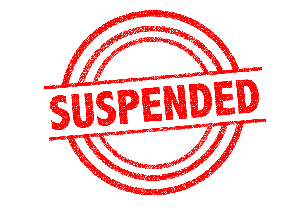 red stamp which says suspended