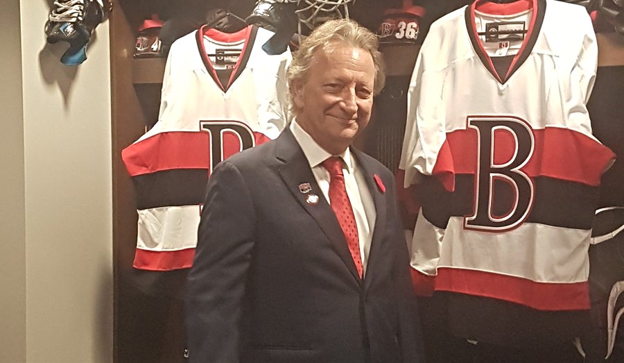 man in suit in sports changing rooms