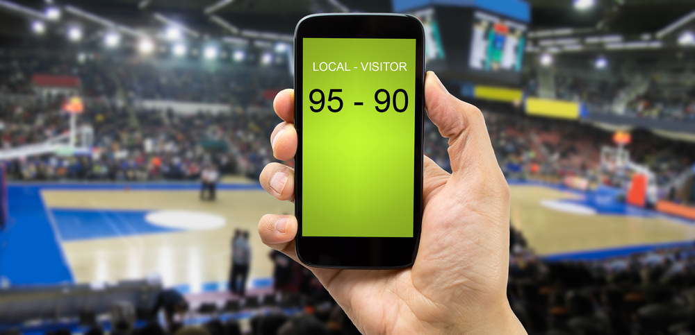 mobile phone displaying basketball game score