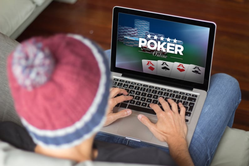 male playing online poker