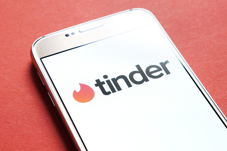 Tinder logo displayed on smartphone