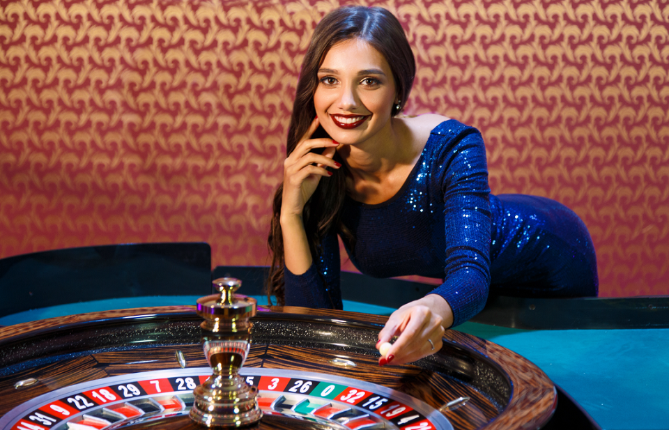 female host at roulette table