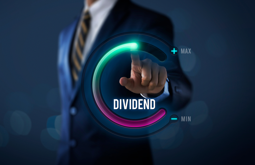 Businessman pulls up circle progress bar with the word DIVIDEND