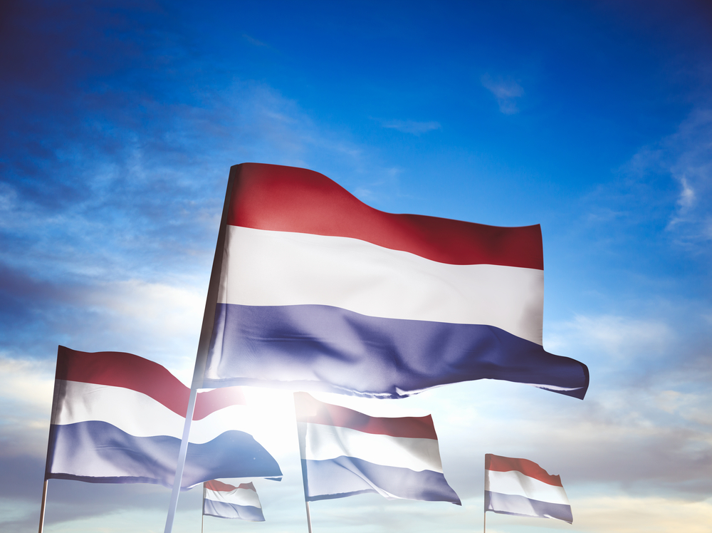 three Netherlands flags