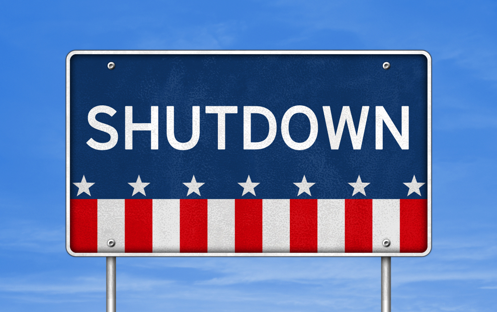 road sign with US flag elements reads shutdown