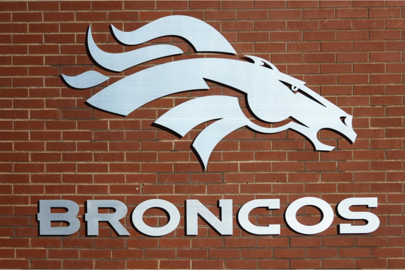 Denver Broncos logo on brick wall