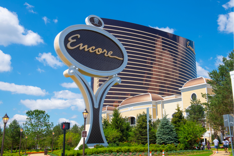 Encore Boston Harbor sign with casino in the background