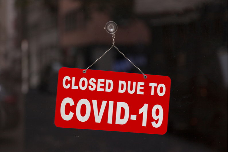 Door sign reading, "CLOSED DUE TO COVID-19"