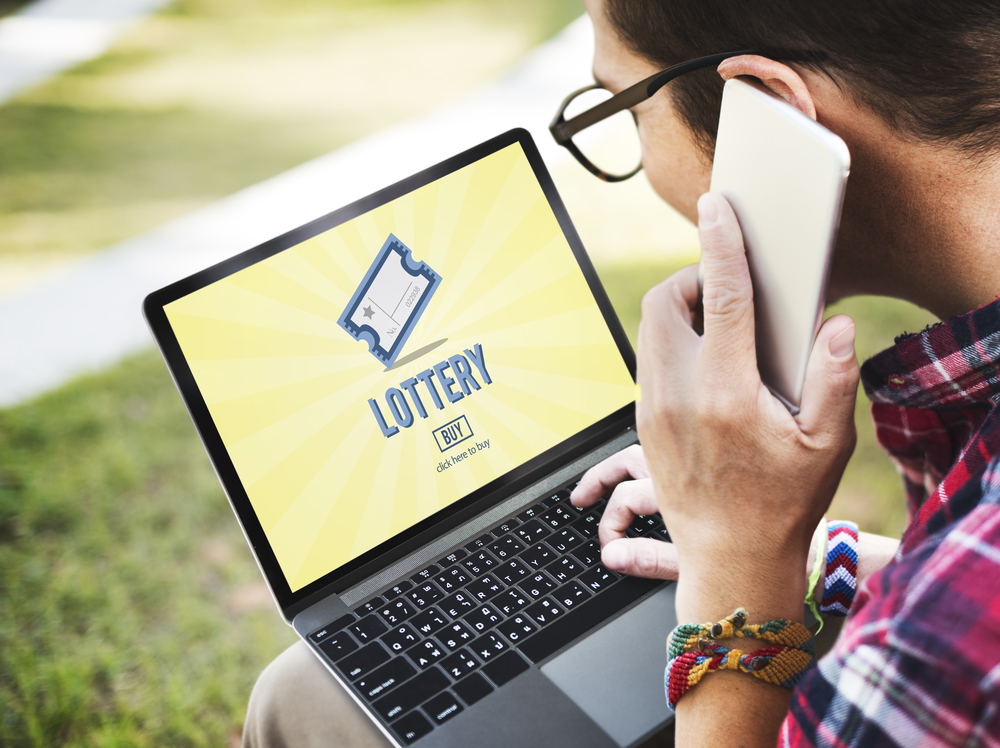 man purchasing lottery ticket online