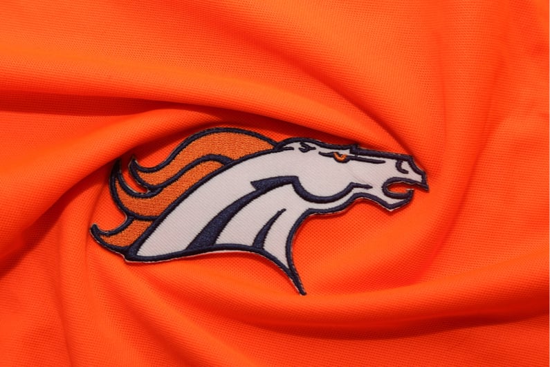 Broncos logo on orange fabric