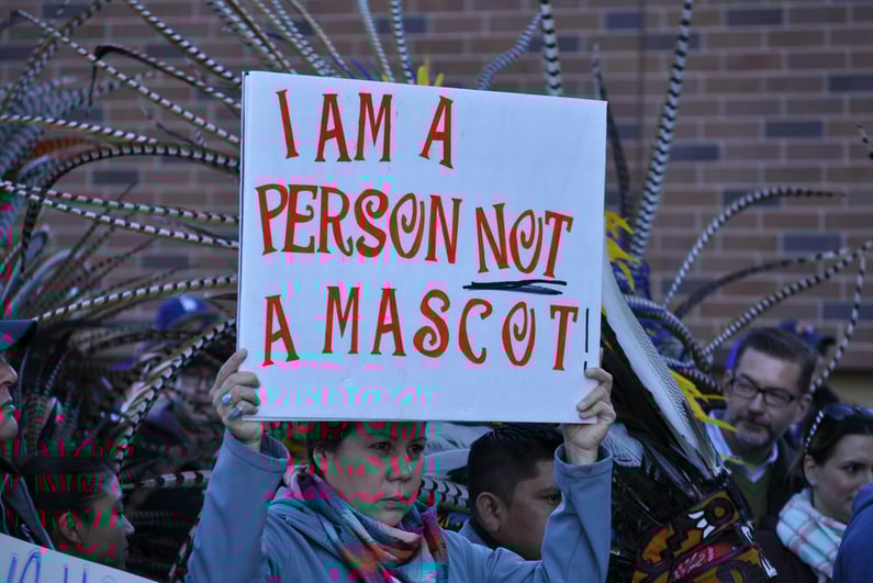 Person protesting the Washington Redskins team name