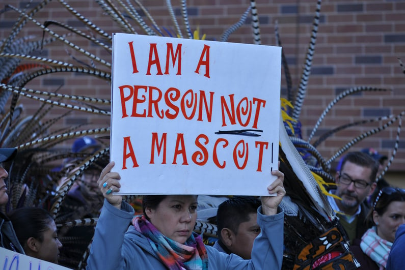 Person protesting the Washington Redskins team name