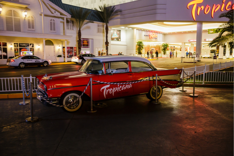 Vintage car with Tropicana logo parked in front of Tropicana Las Vegas