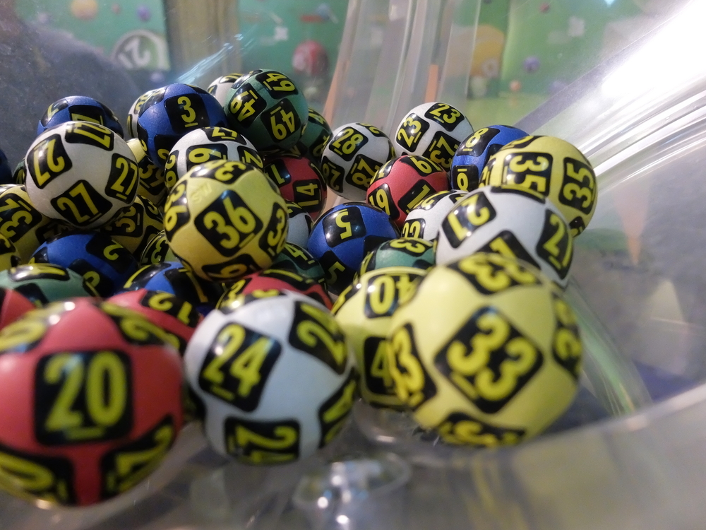 lottery balls inside a lottery draw machine