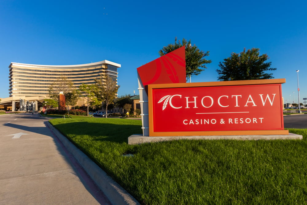 Entrance sign of Choctaw Casino & Resort Oklahoma with the casino building in the background