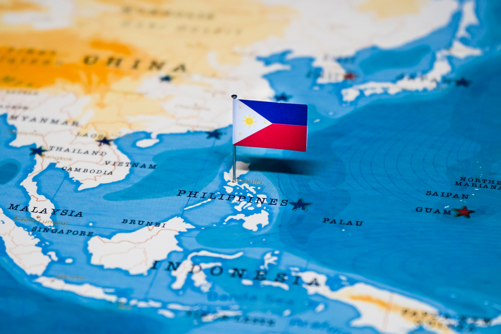 flag of the Philippines pinned on the country's map
