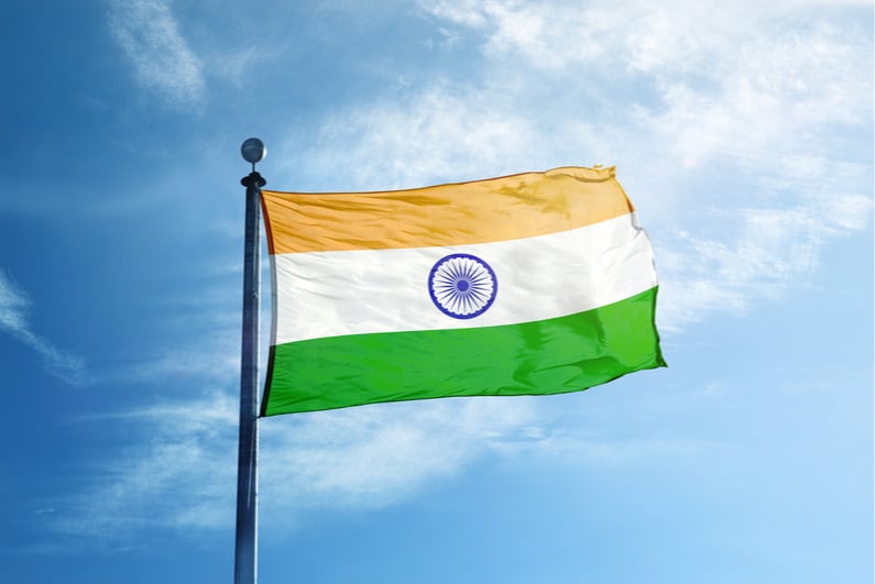 India flag flying against a blue sky