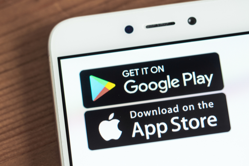 Google Play and Apple App Store icons on a smartphone