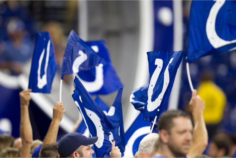 Fans waving Indianapolis Colts flags