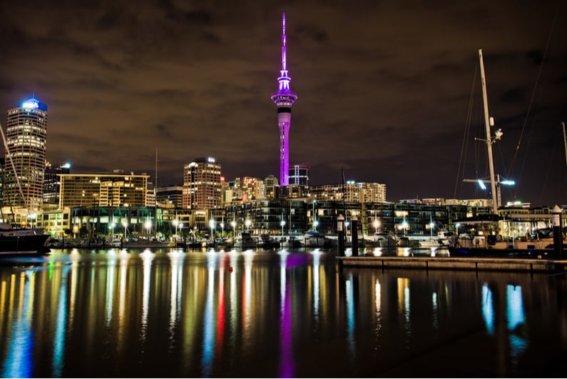 Auckland's SkyCity tower glowing purple