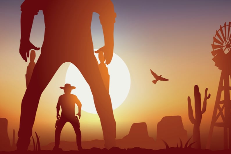 Cowboy showdown at sunset