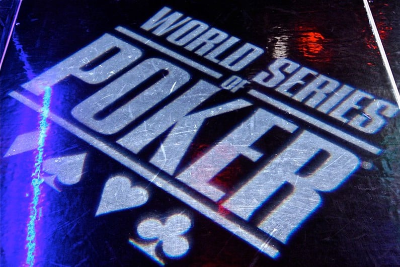 WSOP logo shining on a black floor