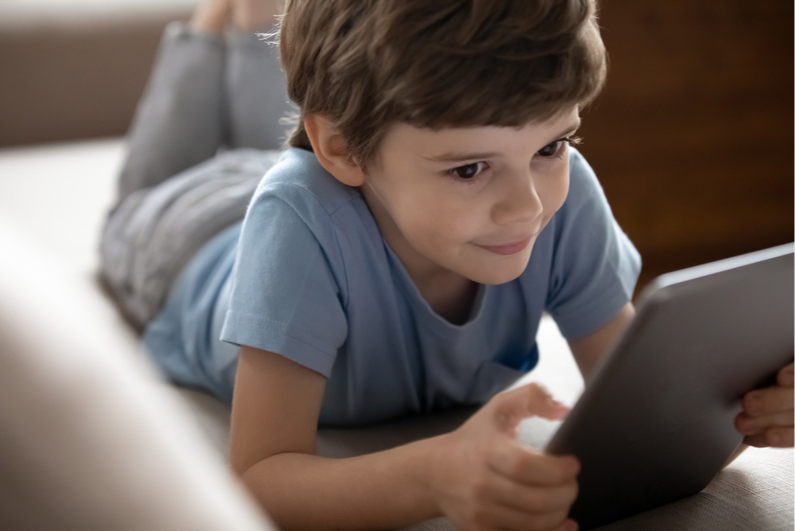 boy looking at a tablet