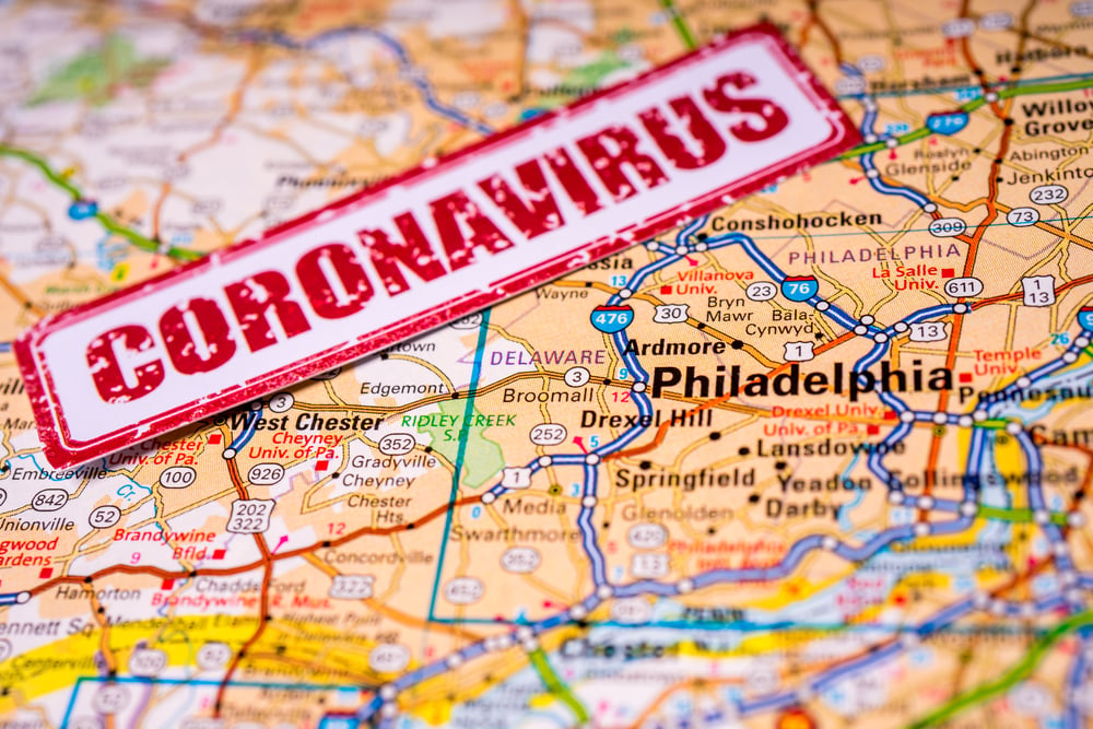 coronavirus stamp on map of Philadelphia and surrounding