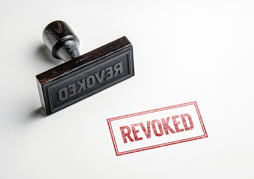"revoked" stamp in red