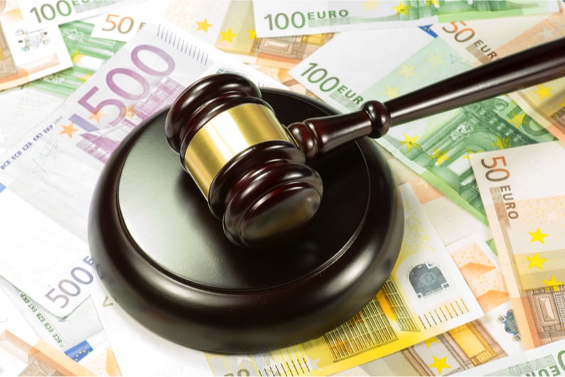 gavel on top of scattered Euro bills