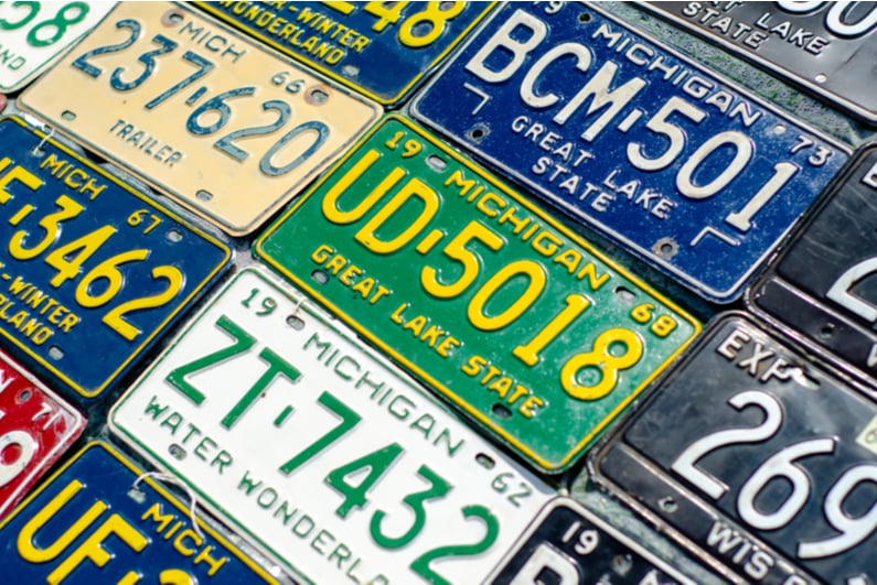 A variety of old Michigan license plates