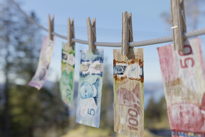 Canadian money drying on a clothesline