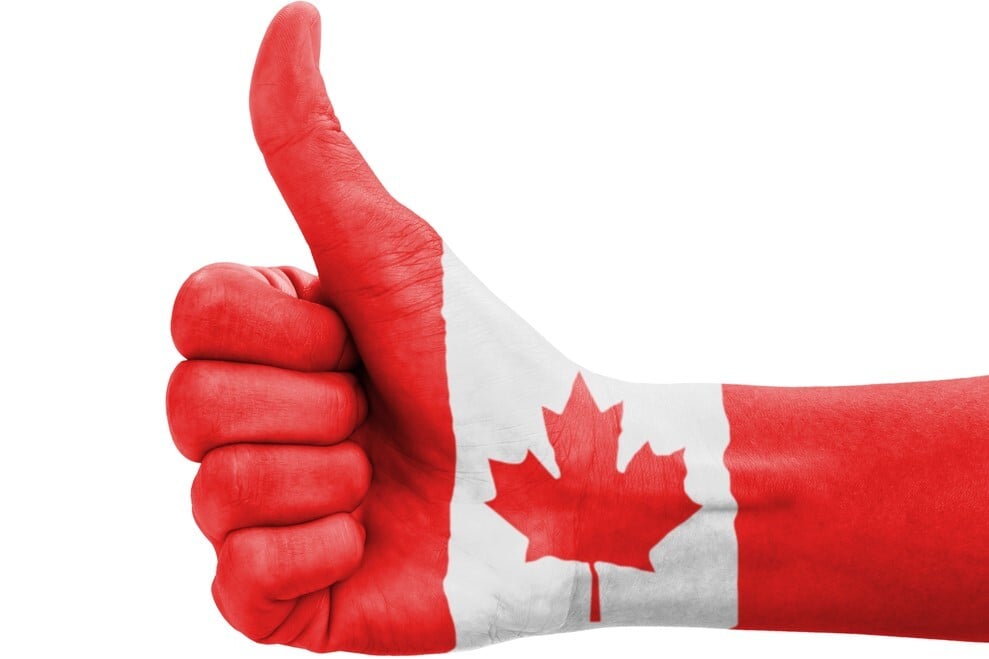 Hand giving thumbs up painted with Canada flag